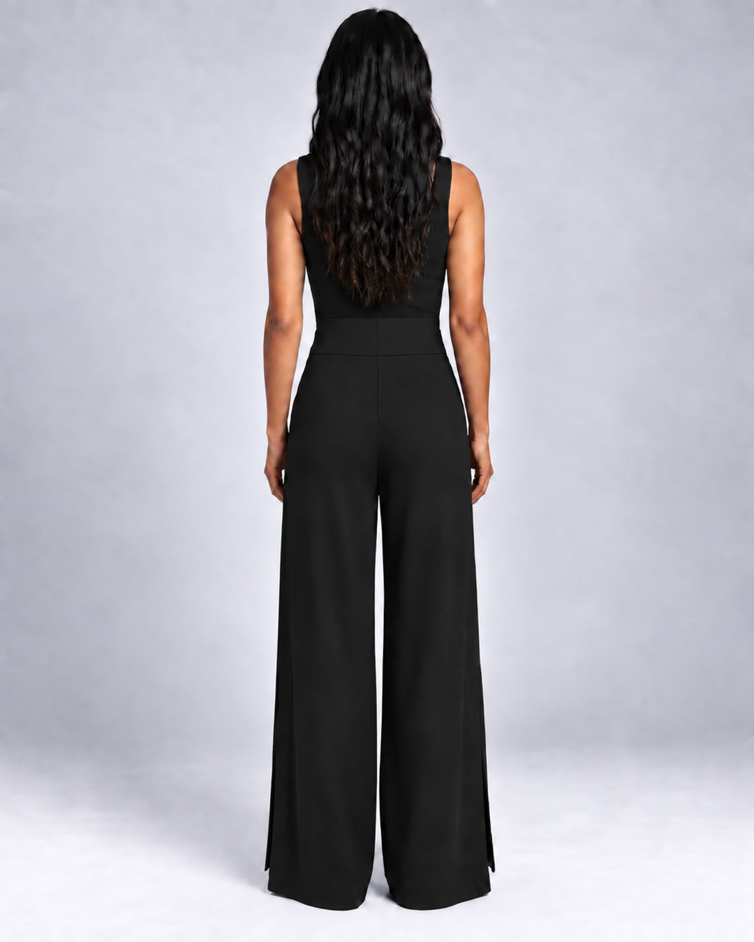 Back view of the Liberty black matte jersey wide-leg pants on a model, showing the broad waistband and fluid leg shape.