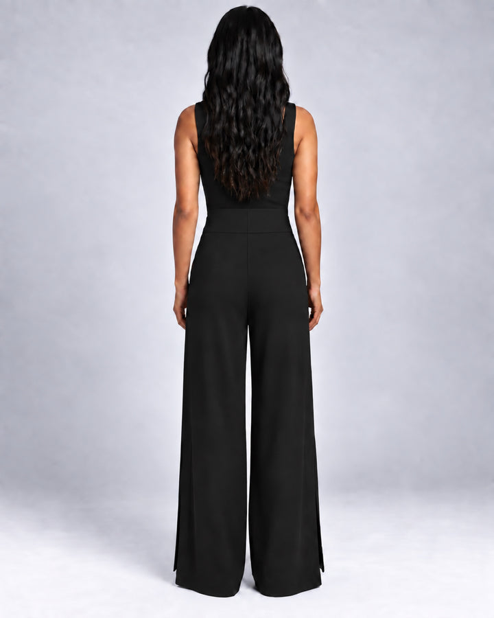 Back view of the Liberty black matte jersey wide-leg pants on a model, showing the broad waistband and fluid leg shape.