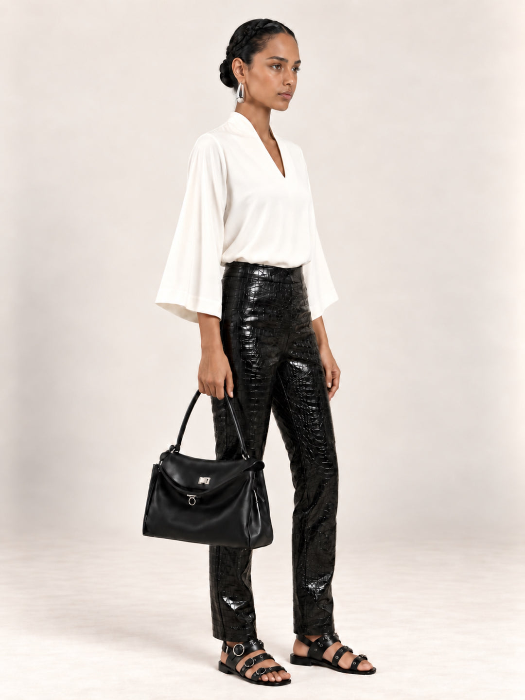 Pearl color option of the Waverly flutter-sleeve top, styled with black Bleeker croc pants